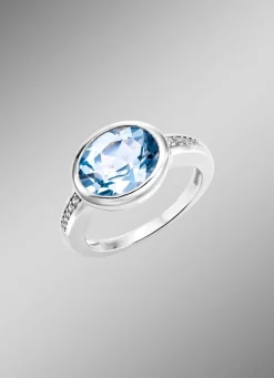 Schicker Damenring mit beh. Blautopas und synth. Zirkonia